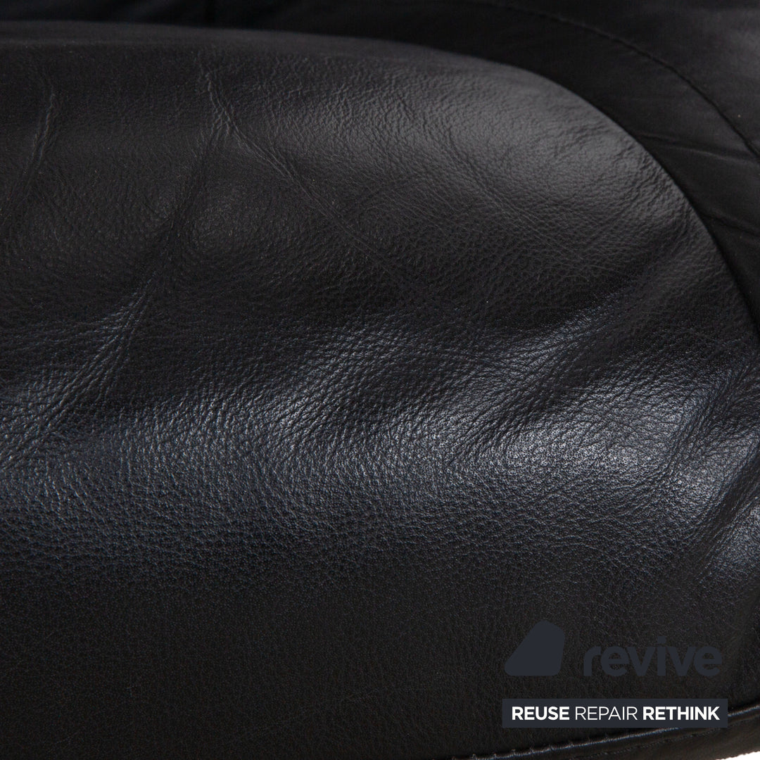 Fauteuil en cuir Stressless Wing noir avec fonction manuelle du tabouret