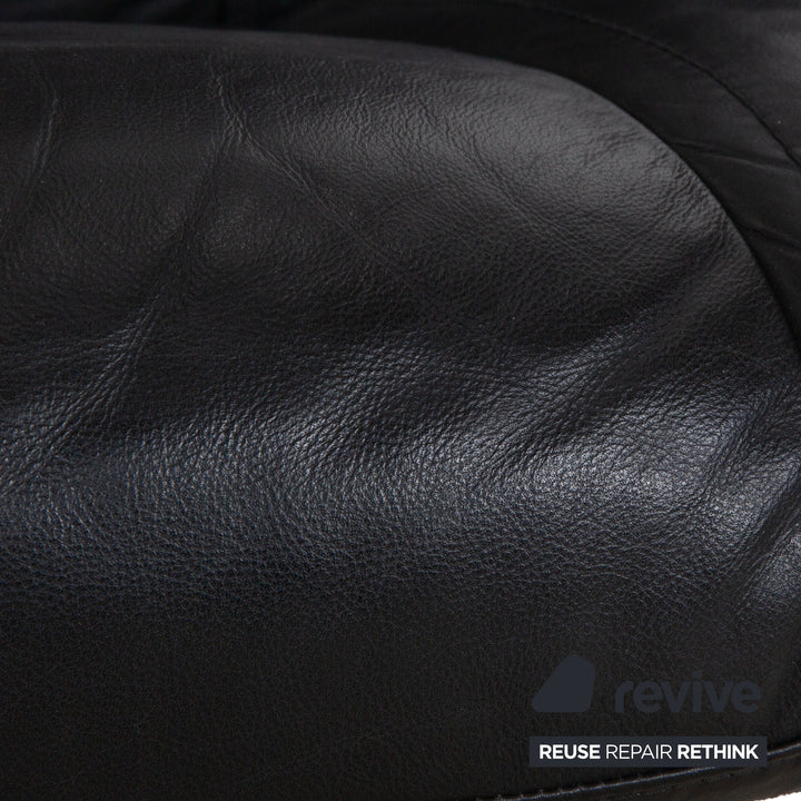 Fauteuil en cuir Stressless Wing noir avec fonction manuelle du tabouret