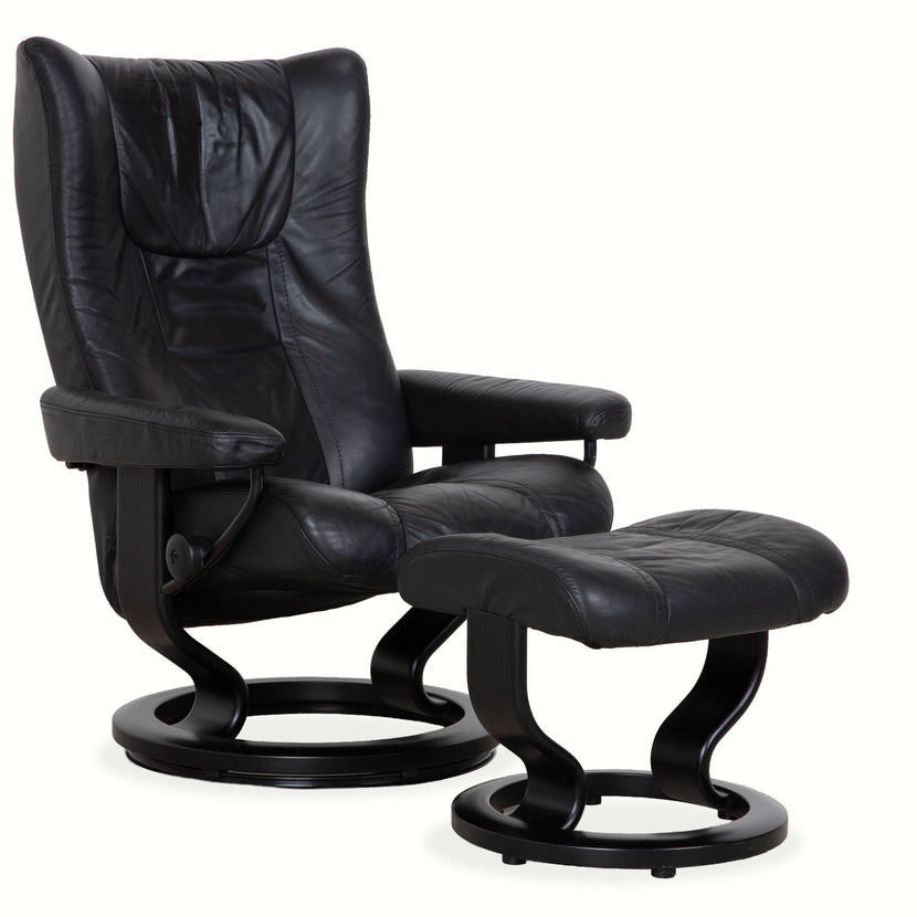 Fauteuil en cuir Stressless Wing noir avec fonction manuelle du tabouret