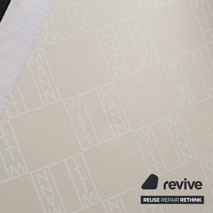 Wittmann Aura Leder Sessel Schwarz Messingkappen